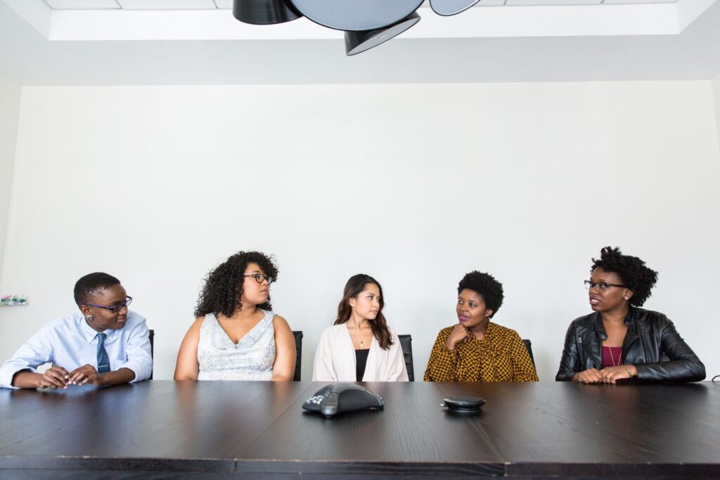 A diverse group of colleagues collaborating around a table in a modern office